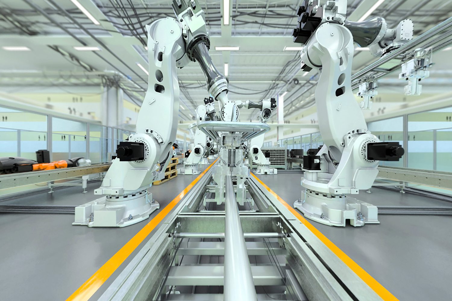 Robots working on a high-volume manufacturing production line